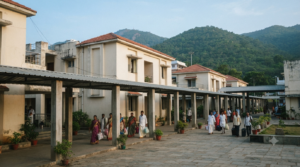 Ampro Guest House Tirumala guide with pilgrims at a TTD accommodation allotment counter