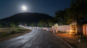 Pilgrims walking the Tiruvannamalai Girivalam dates route around Arunachala Hill on a full moon night