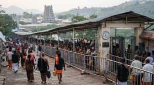 Tirumala darshan late entry guide showing pilgrims waiting near a timed TTD queue entrance