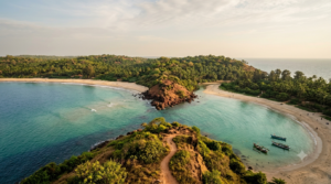 Gokarna trip plan: clifftop view of Om Beach twin crescents and laterite headlands, coastal Karnataka